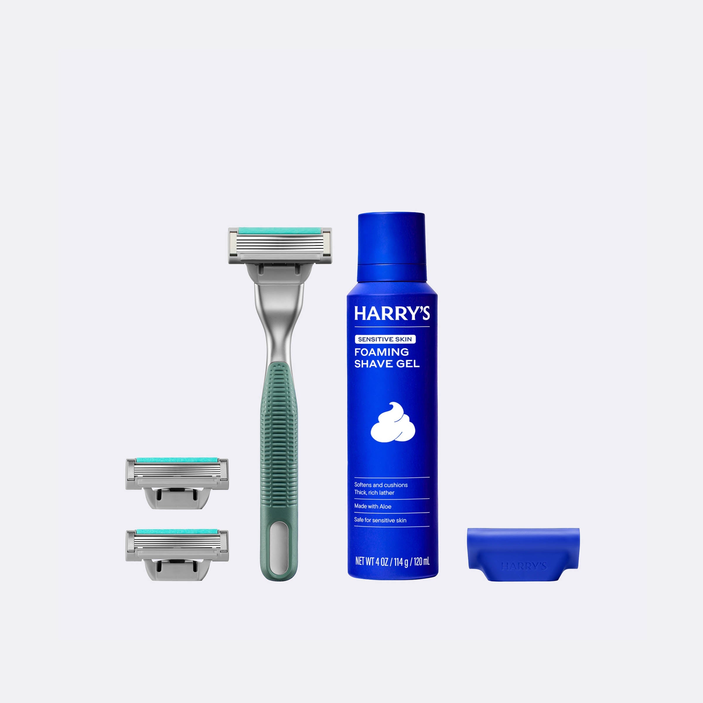 Harry's shaving product set with a blue bottle, razor, and shaver heads on a white background