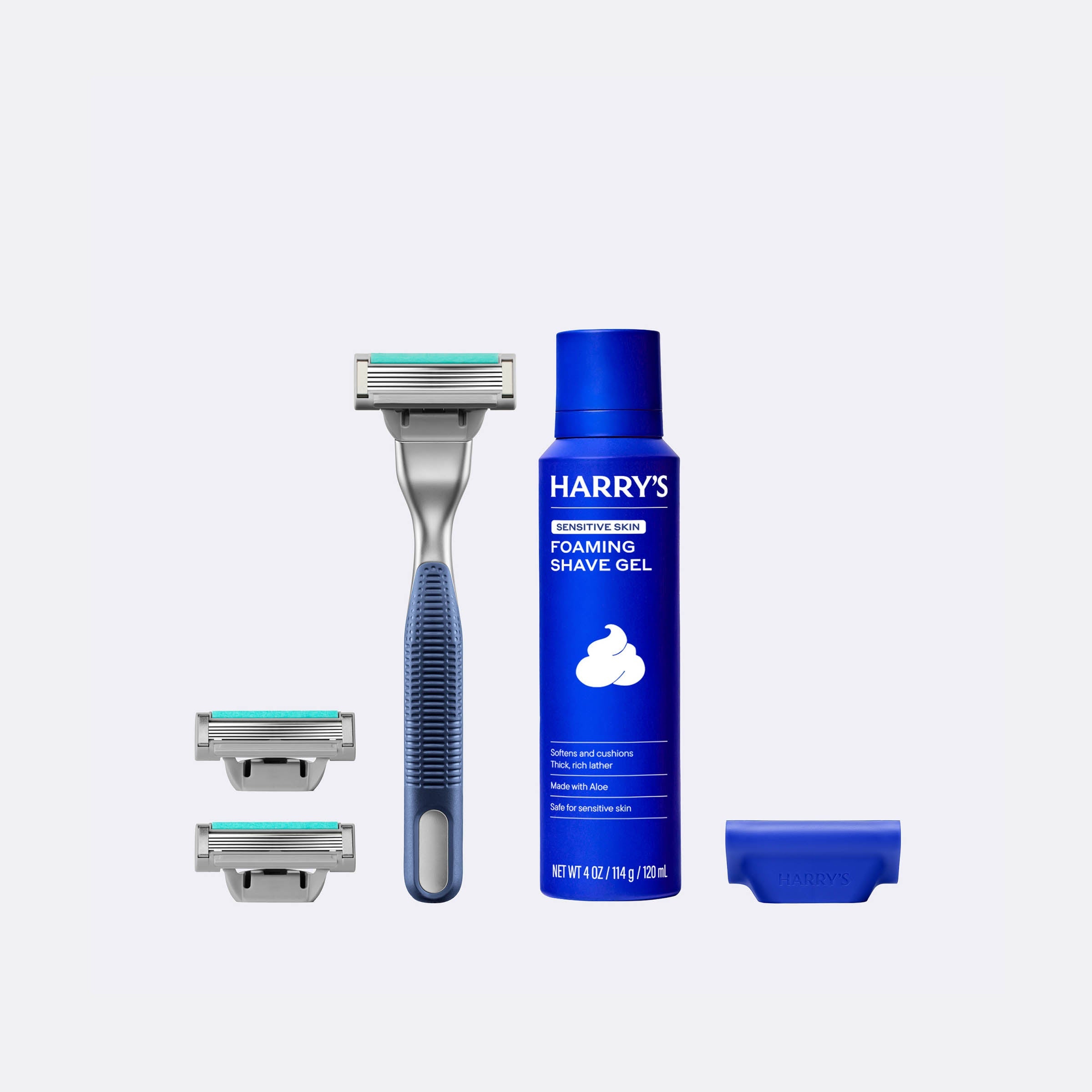 Harry's shaving product set including a razor, shaver heads, and foaming shave gel on a white background