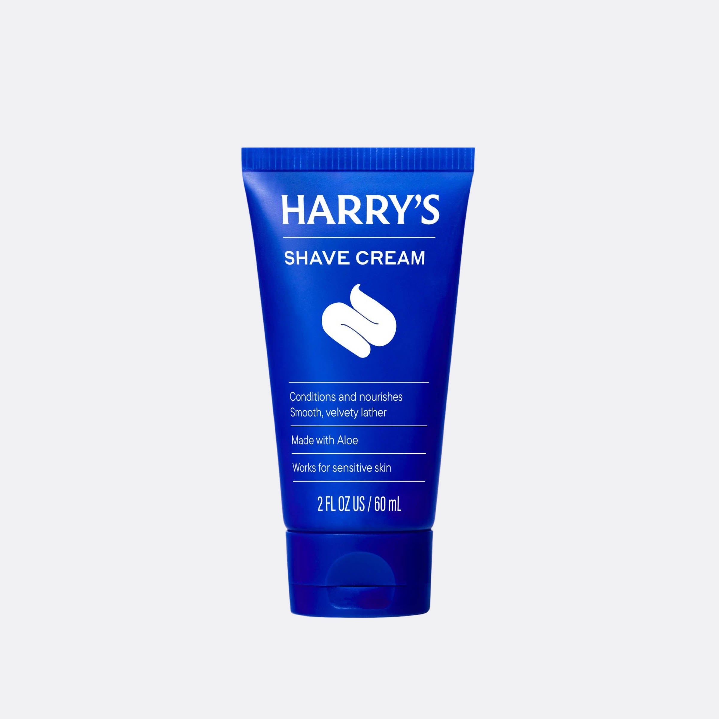 Blue tube of Harry's Shave Cream on a white background