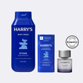 Three Harry's body products including body wash, antiperspirant, and cologne on a light gray background.