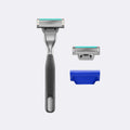 Harry's Plus Razor in the color Onyx next to an extra blade cartridge and the blade cover on a white background.